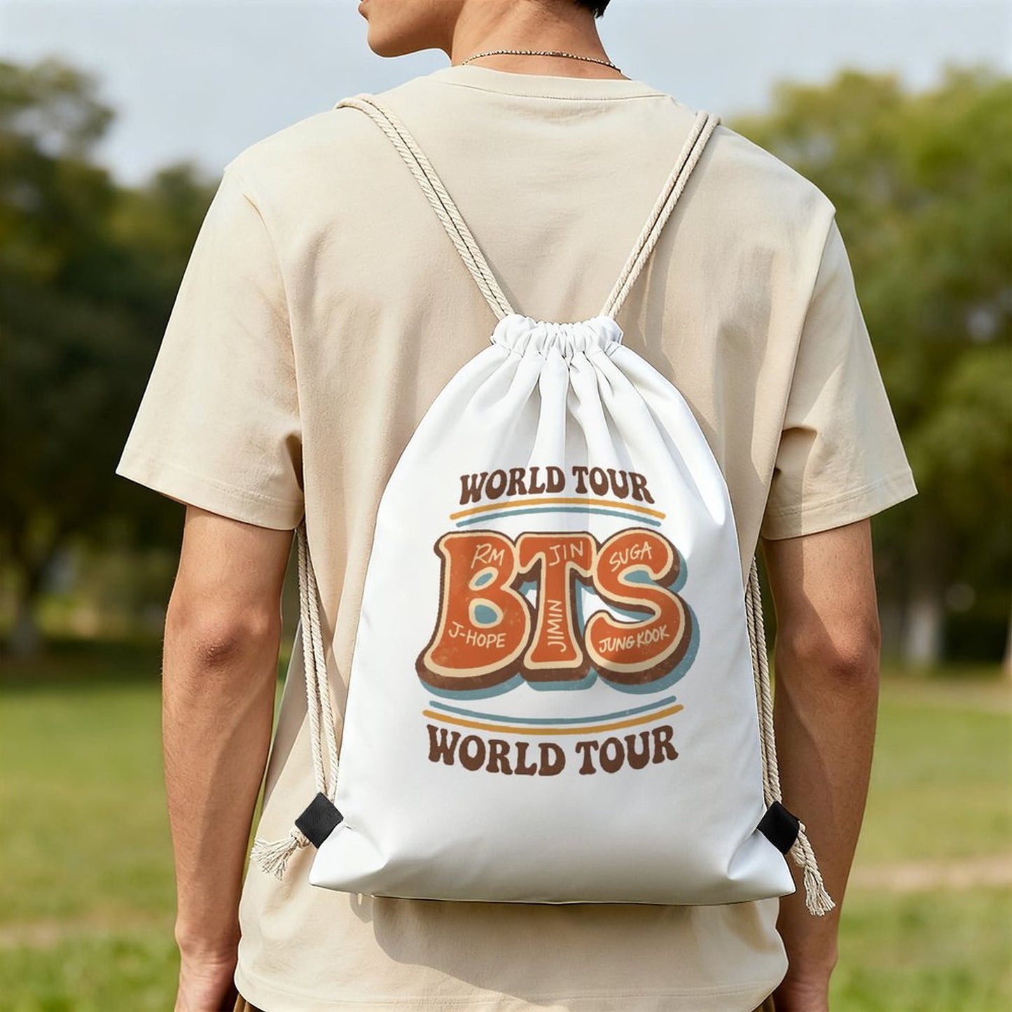 A front view of a white premium polyester drawstring backpack featuring a retro high-contrast black and red BTS world tour graphic illustration.