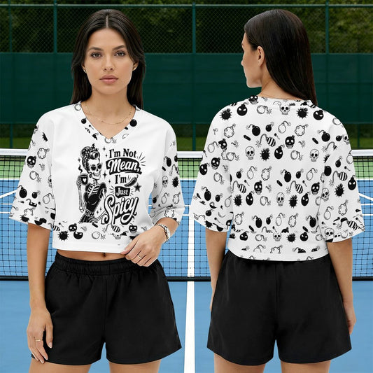 Lifestyle view of a model showcasing the short-sleeve white graphic polo jersey shirt with the text "I'm Not Mean I'm Spicy" integrated into an alt fashion aesthetic outfit.