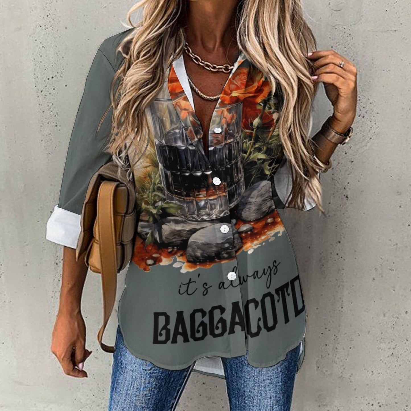 A front view of a white women's long sleeve tunic shirt featuring an edgy black and red 'It's always Baggacotd' bookish slogan graphic print.
