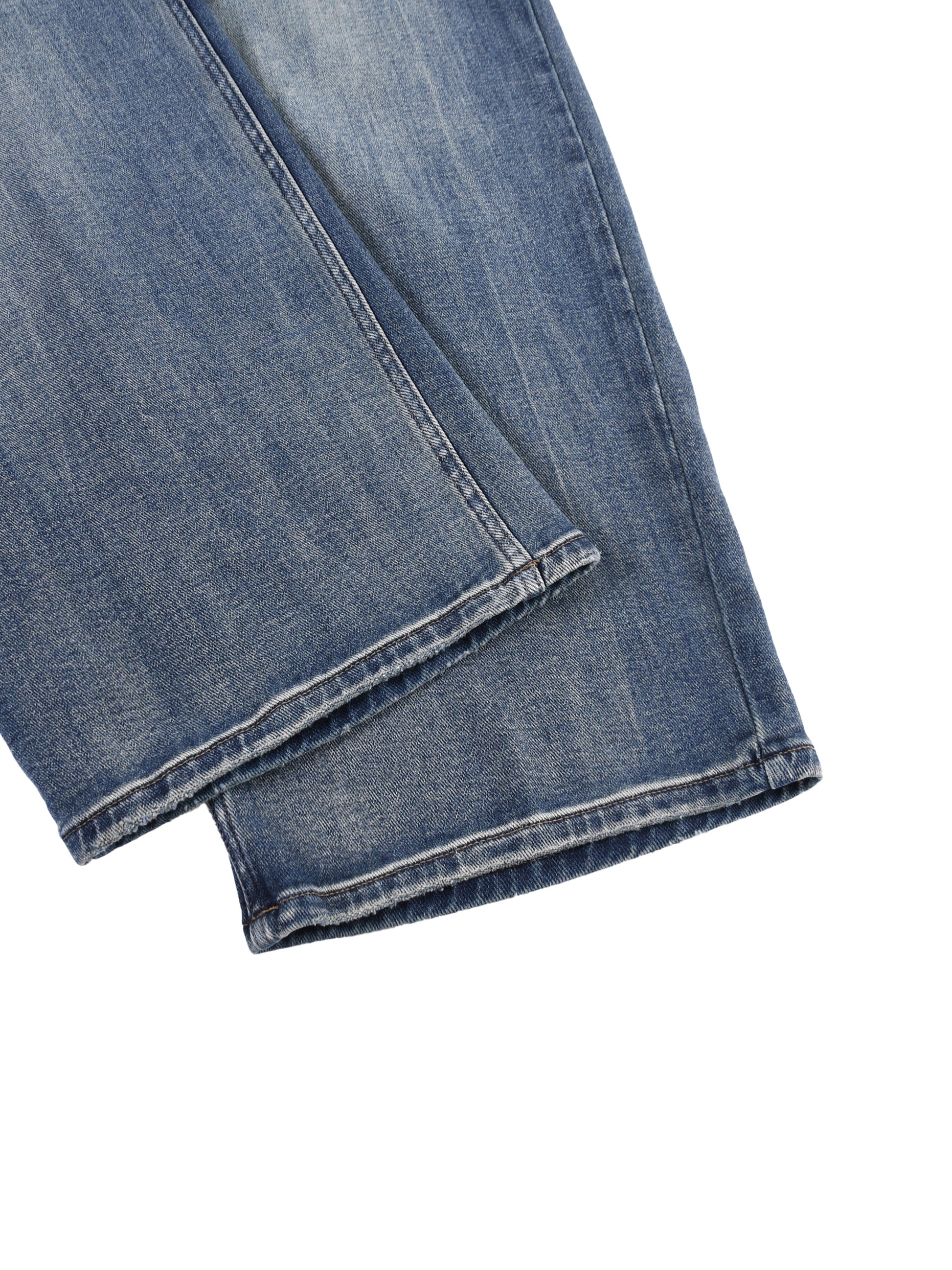 Close-up view of the clean, double-stitched ankle cuffs and premium washed denim texture on the BT21 King TATA wide-leg jeans.