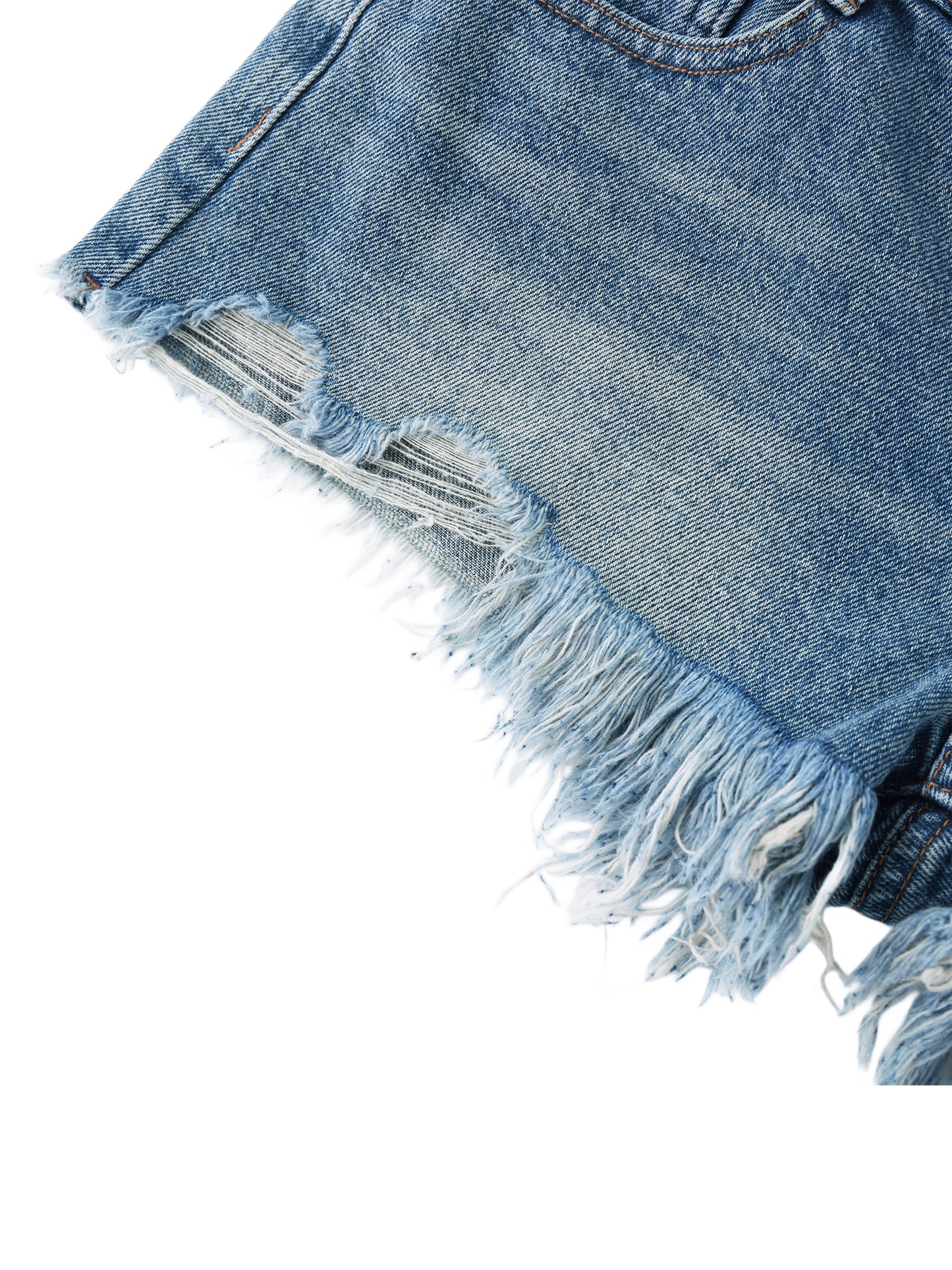 Macro close-up view of the heavily frayed raw edge hem and distressed ripped details on blue vintage wash denim shorts.