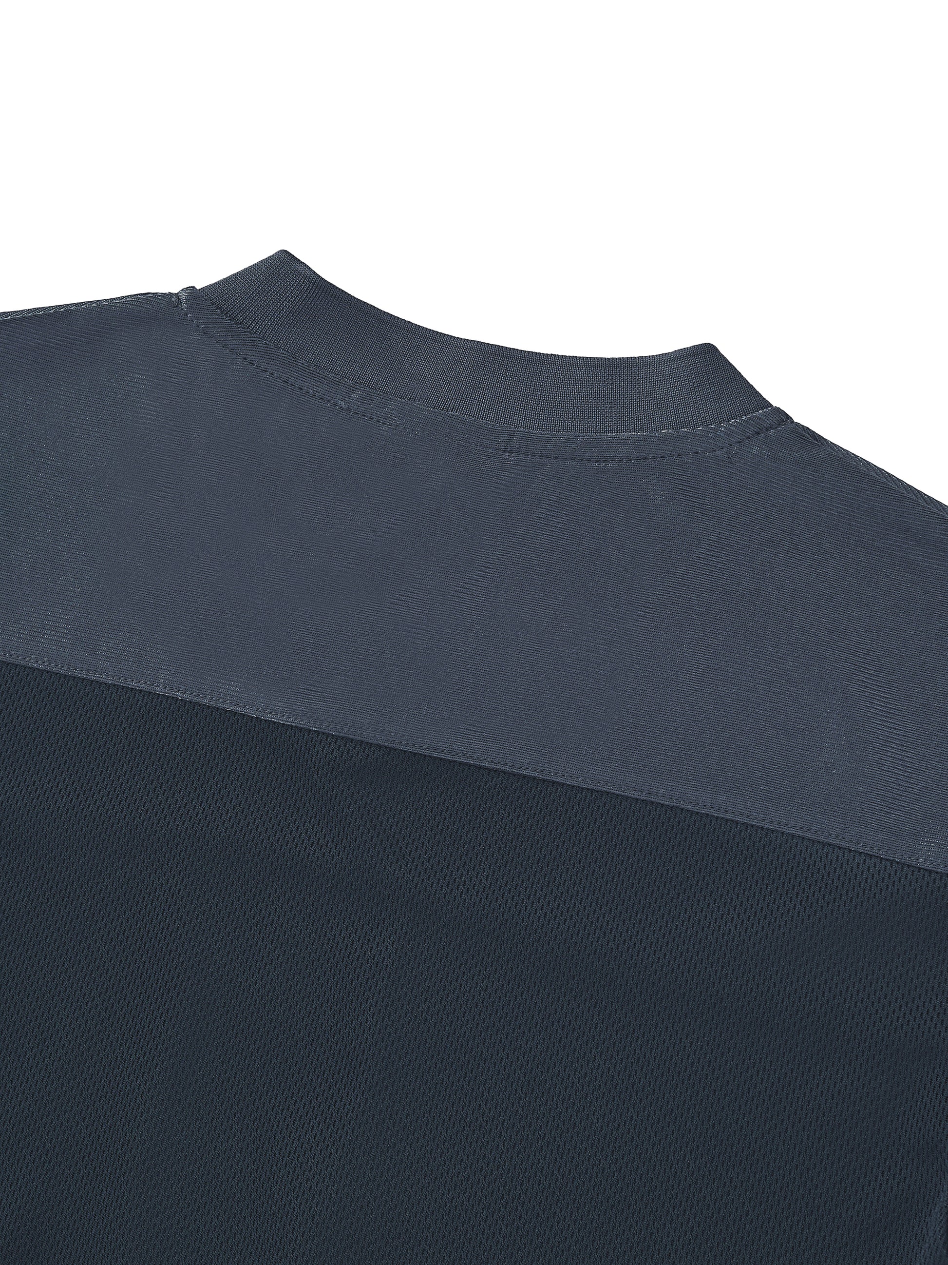 Macro close-up view of the dark gray mesh patchwork layout on the back shoulder of the BTS V cropped jersey, showcasing the breathable hollow-out fabric construction.
