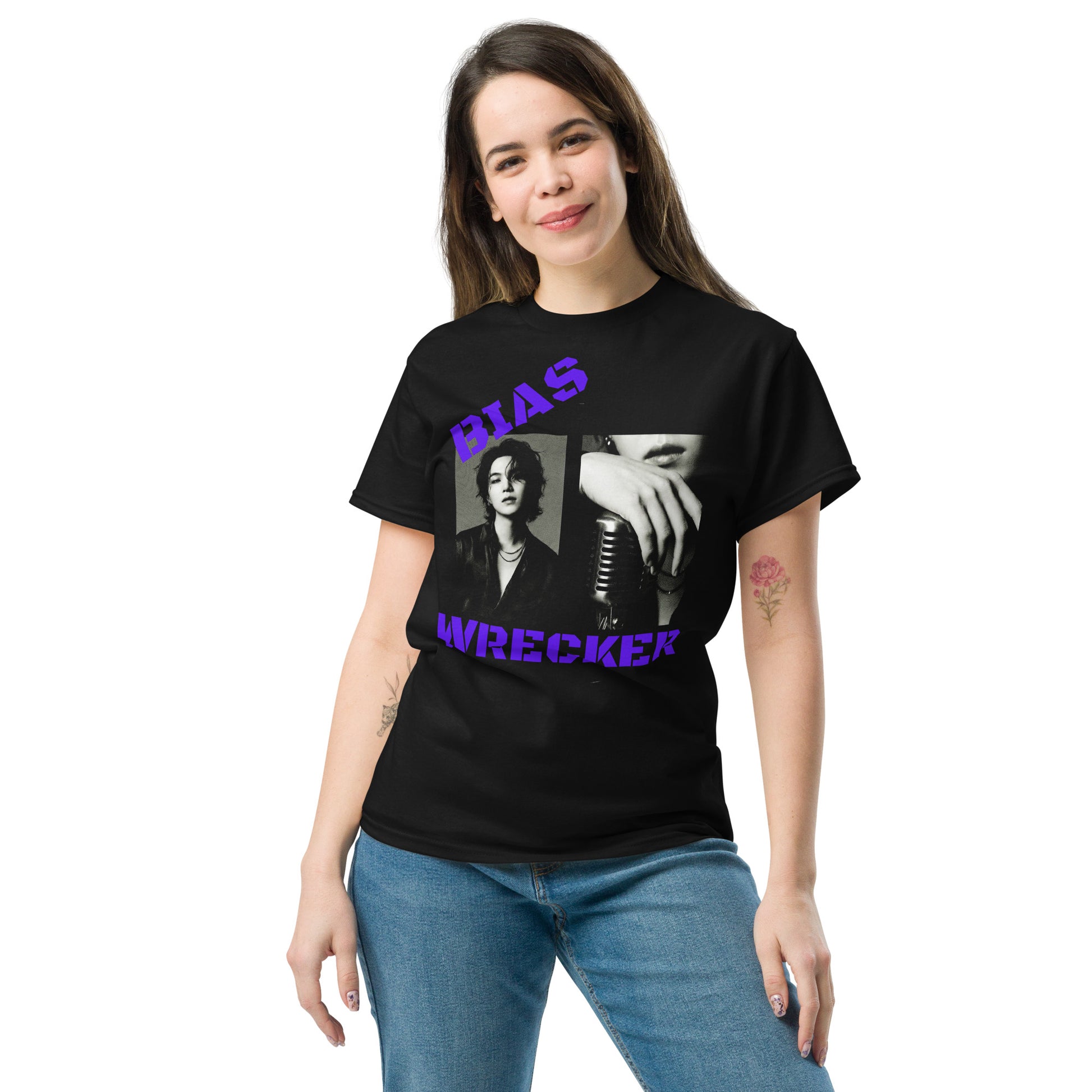 Front view mockup of a model with long brown hair wearing the black "Bias Wrecker" BTS graphic t-shirt, paired with blue jeans against a plain white background. The shirt features bold purple text and a high-definition edgy grayscale print of BTS members.